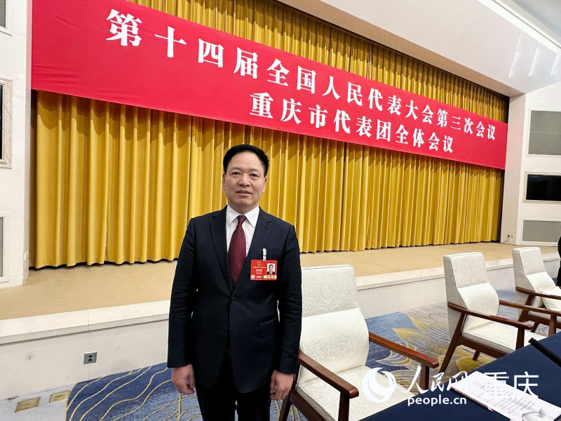 全國人大代表、重慶市人大民族宗教僑務外事委員會副主任委員錢建超。人民網(wǎng)記者 劉政寧攝